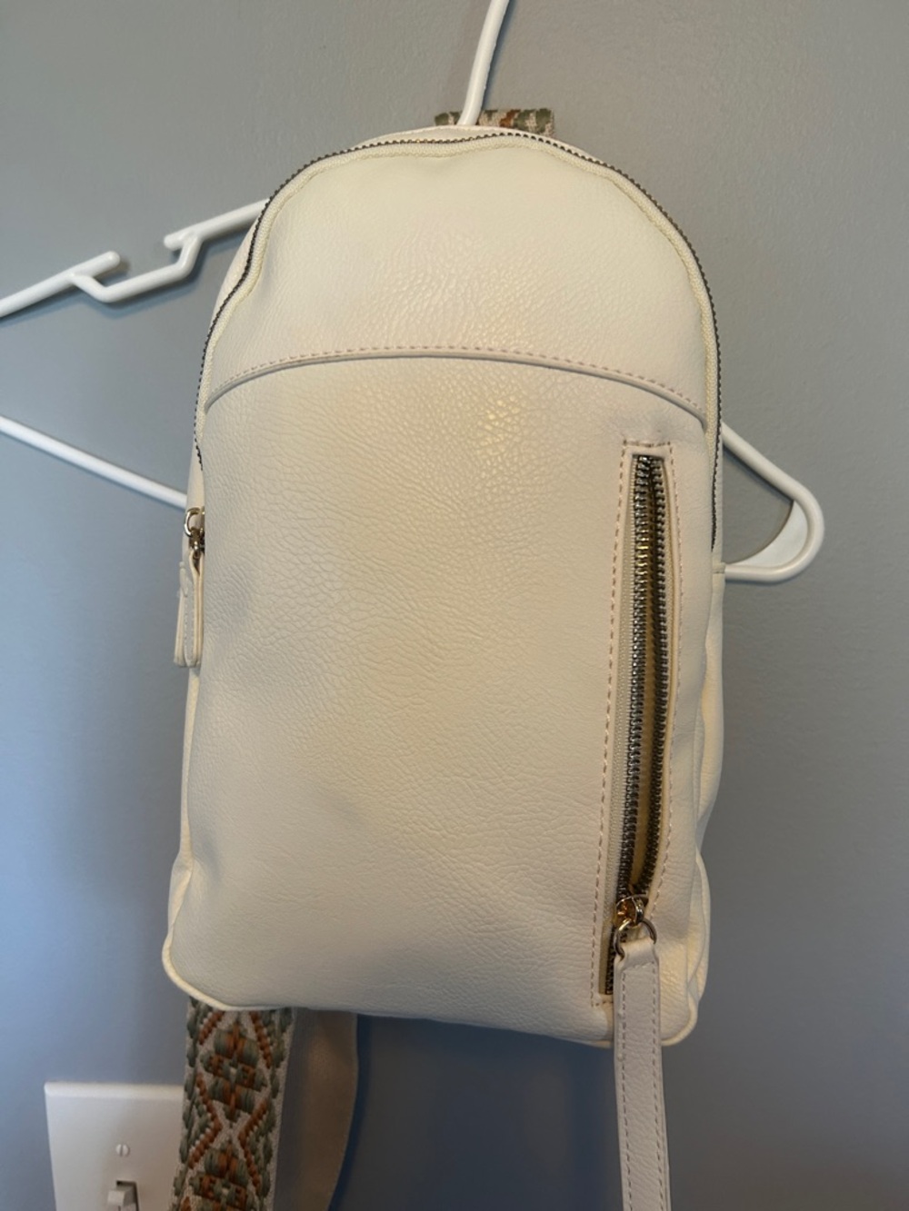 Cream Pebble Crossbody Backpack with Gold Accents